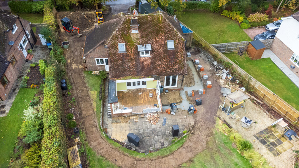Summerhill: single- and two-storey garage extension with front, side & rear additions and roof remodel.